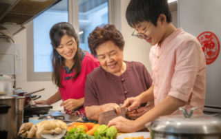 image of family cooking together