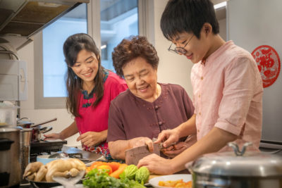 image of family cooking together